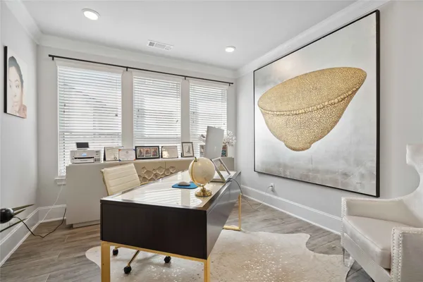 a living room with furniture a table and a large window