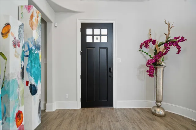 a view of entryway with wooden floor