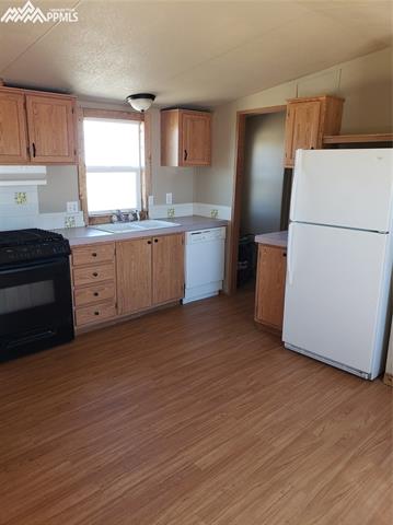 29965 Elway Point Yoder, CO 80864 - Photo 5 of 13 All kitchen appliances come with the home.