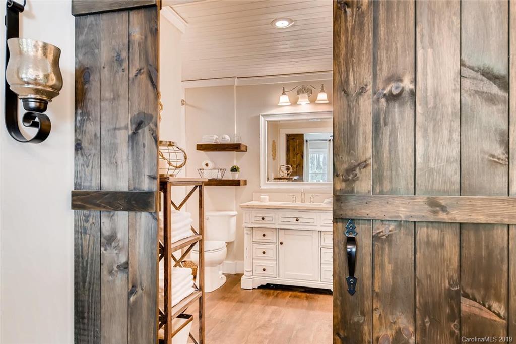 10840 Valley Hill Road Indian Land, SC 29707 - Photo 15 of 37 a view of walk in closet with clothes and shoes