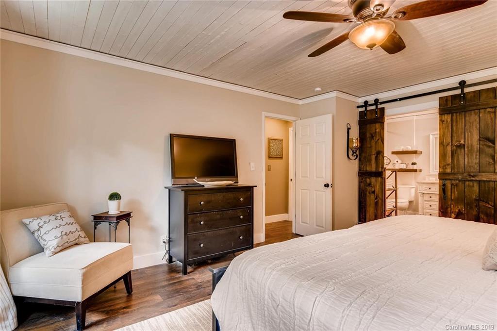 10840 Valley Hill Road Indian Land, SC 29707 - Photo 17 of 37 a bedroom with a bed and a flat screen tv