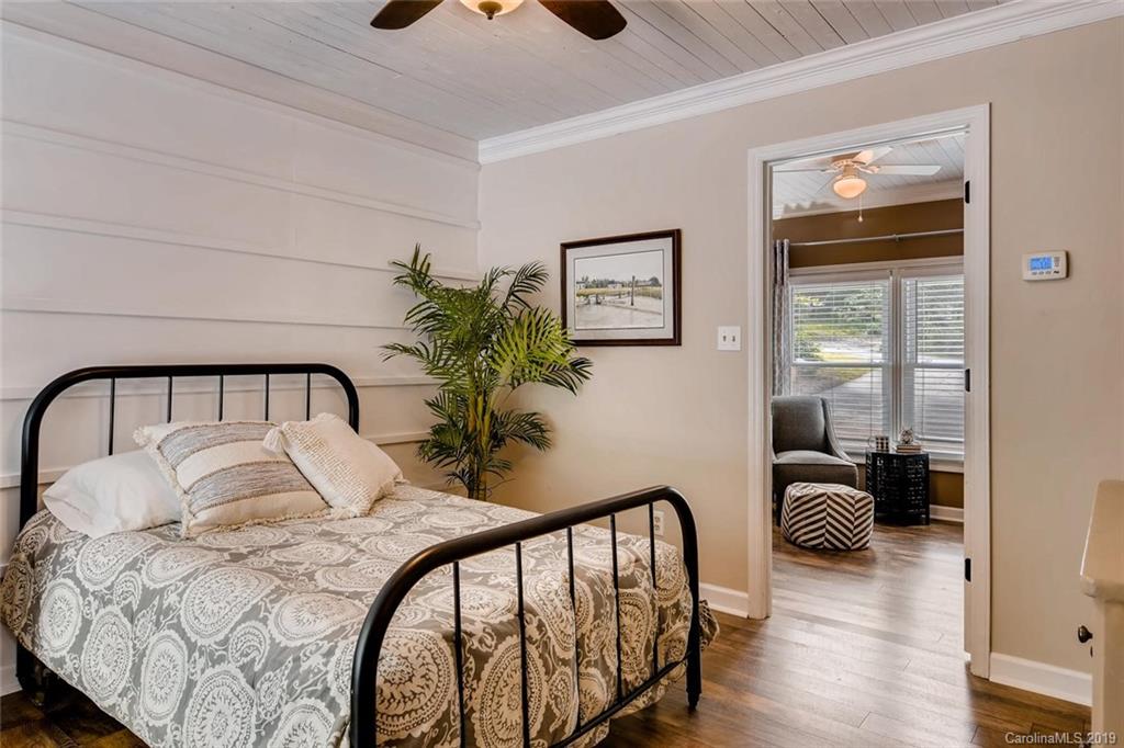 10840 Valley Hill Road Indian Land, SC 29707 - Photo 19 of 37 a bedroom with a bed and wooden floor