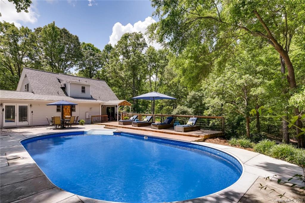 10840 Valley Hill Road Indian Land, SC 29707 - Photo 3 of 37 a view of a swimming pool with lounge chair