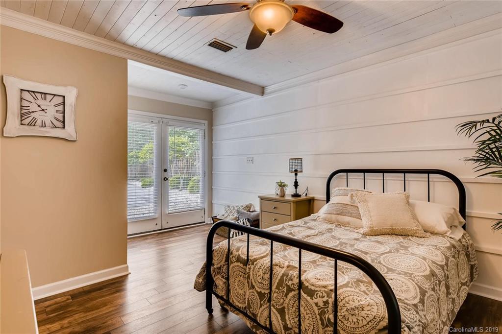 10840 Valley Hill Road Indian Land, SC 29707 - Photo 21 of 37 a bedroom with a bed and a large window with wooden floor