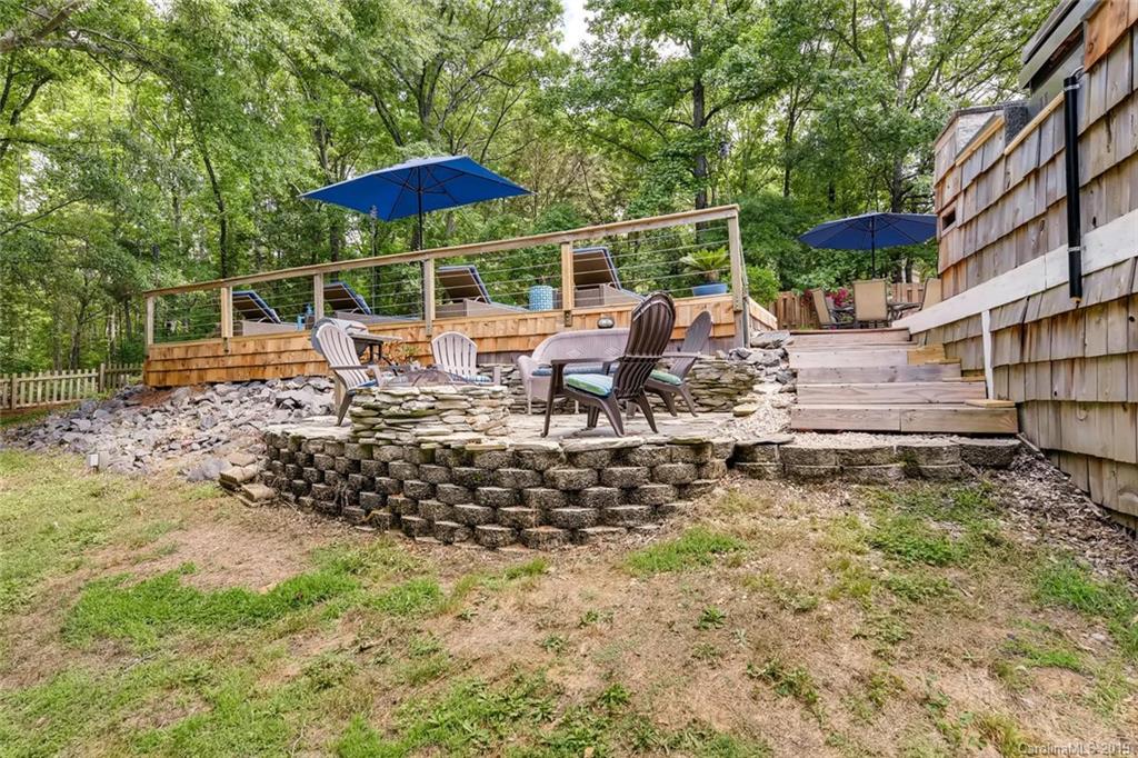 10840 Valley Hill Road Indian Land, SC 29707 - Photo 33 of 37 a view of a chair and tables in the backyard