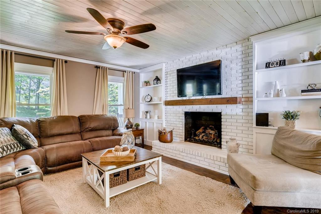 10840 Valley Hill Road Indian Land, SC 29707 - Photo 8 of 37 a living room with furniture and a fireplace