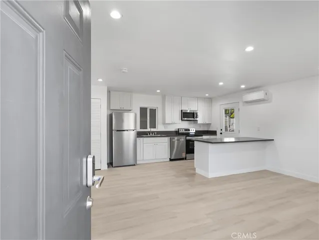 a view of kitchen with wooden floor