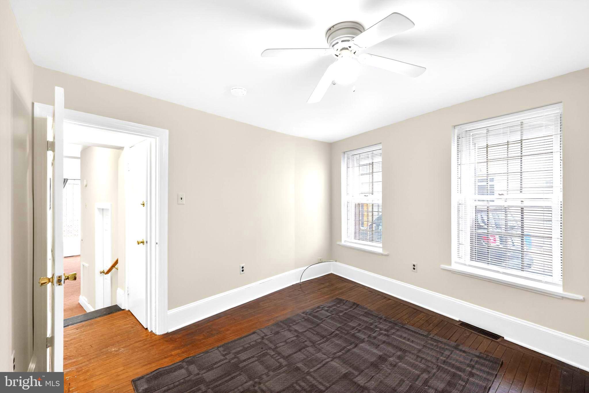 4417 Baker Street Philadelphia, PA 19127 - Photo 11 of 50 a view of an empty room with a window and wooden floor