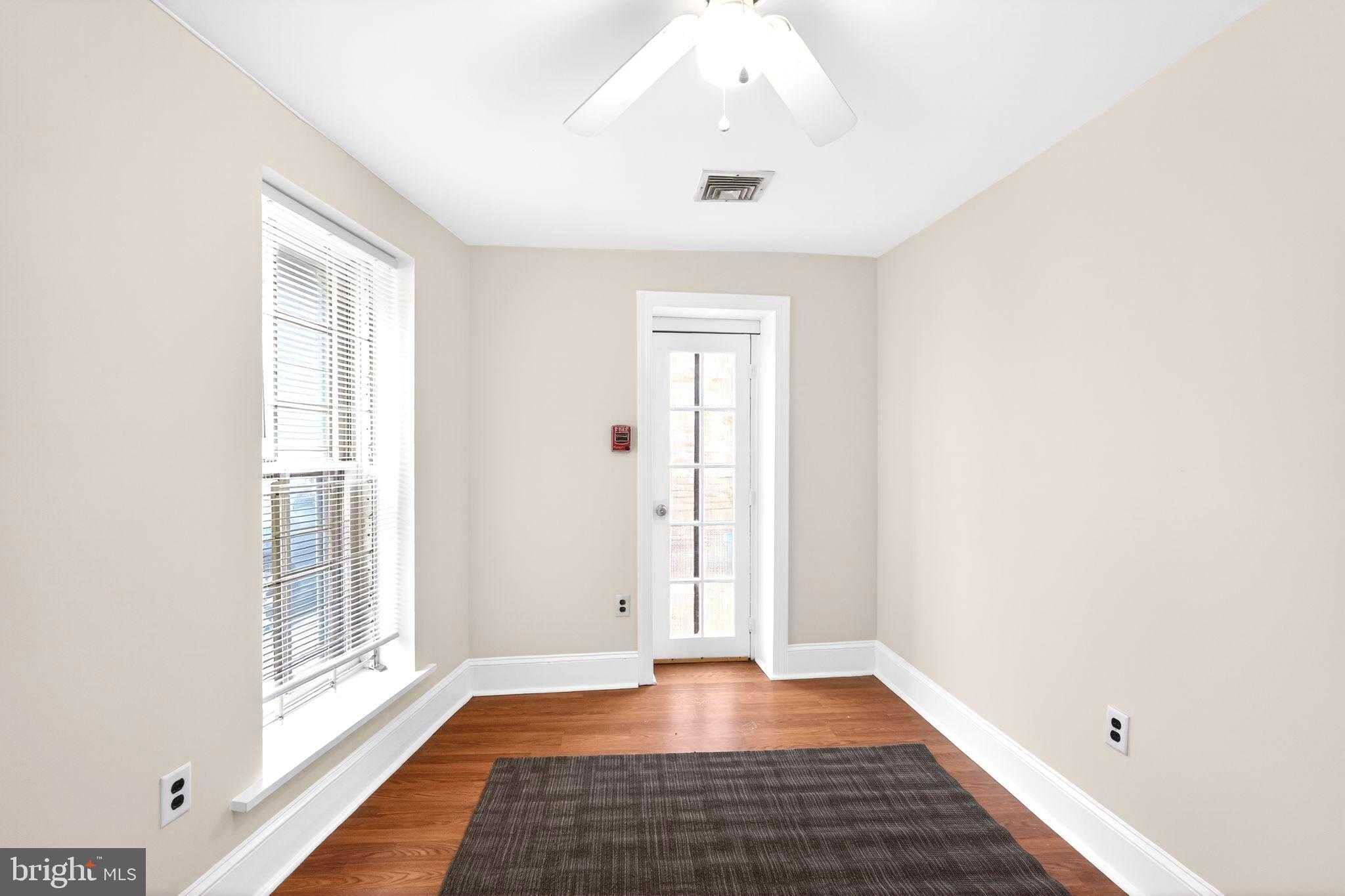 4417 Baker Street Philadelphia, PA 19127 - Photo 13 of 50 a view of an empty room with wooden floor and a window