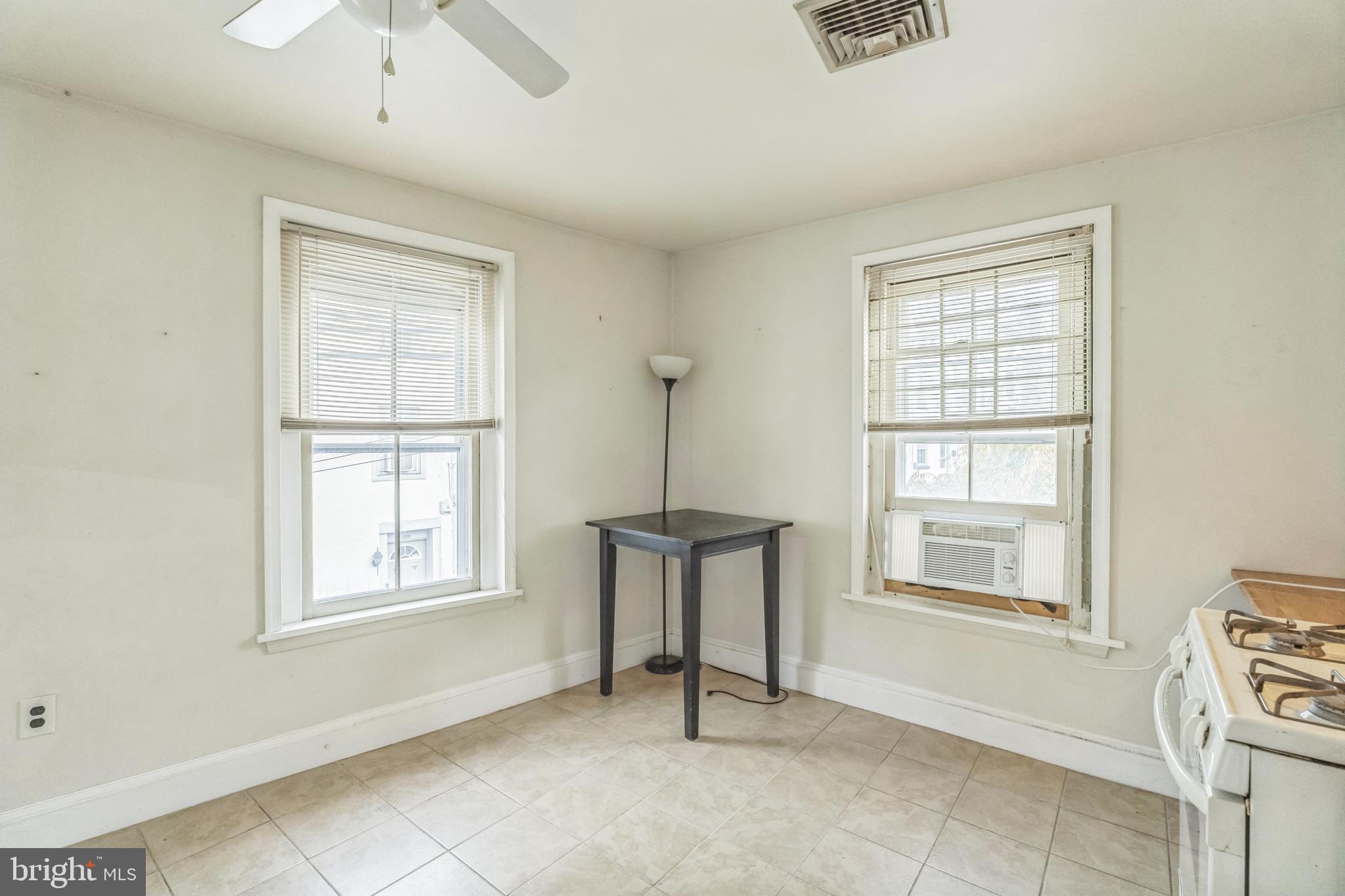 4417 Baker Street Philadelphia, PA 19127 - Photo 16 of 50 an empty room with windows and cabinet