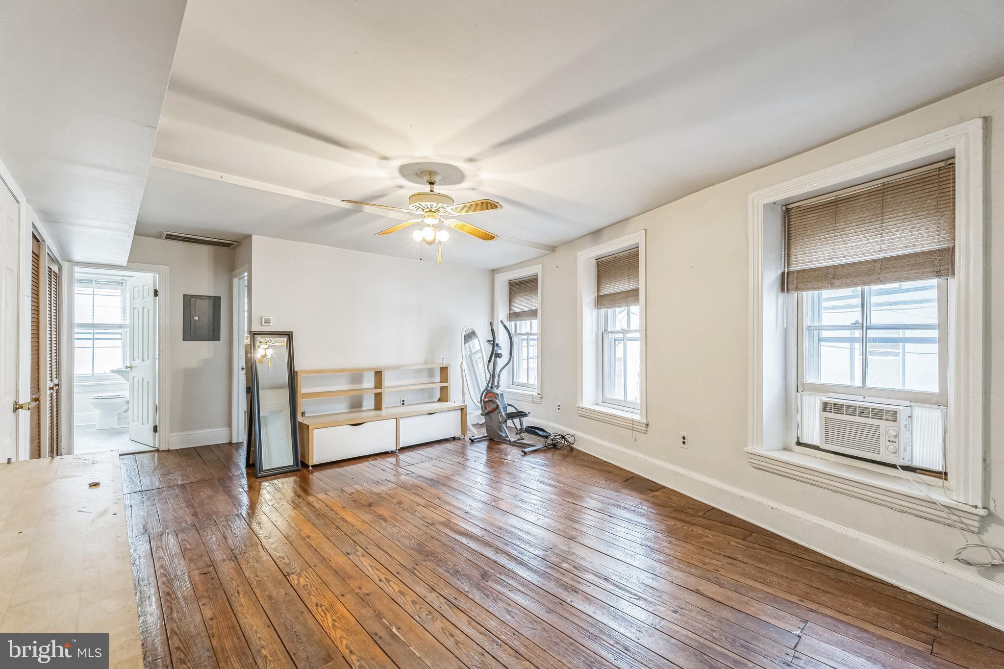 4417 Baker Street Philadelphia, PA 19127 - Photo 18 of 50 a view of an empty room with wooden floor and a window