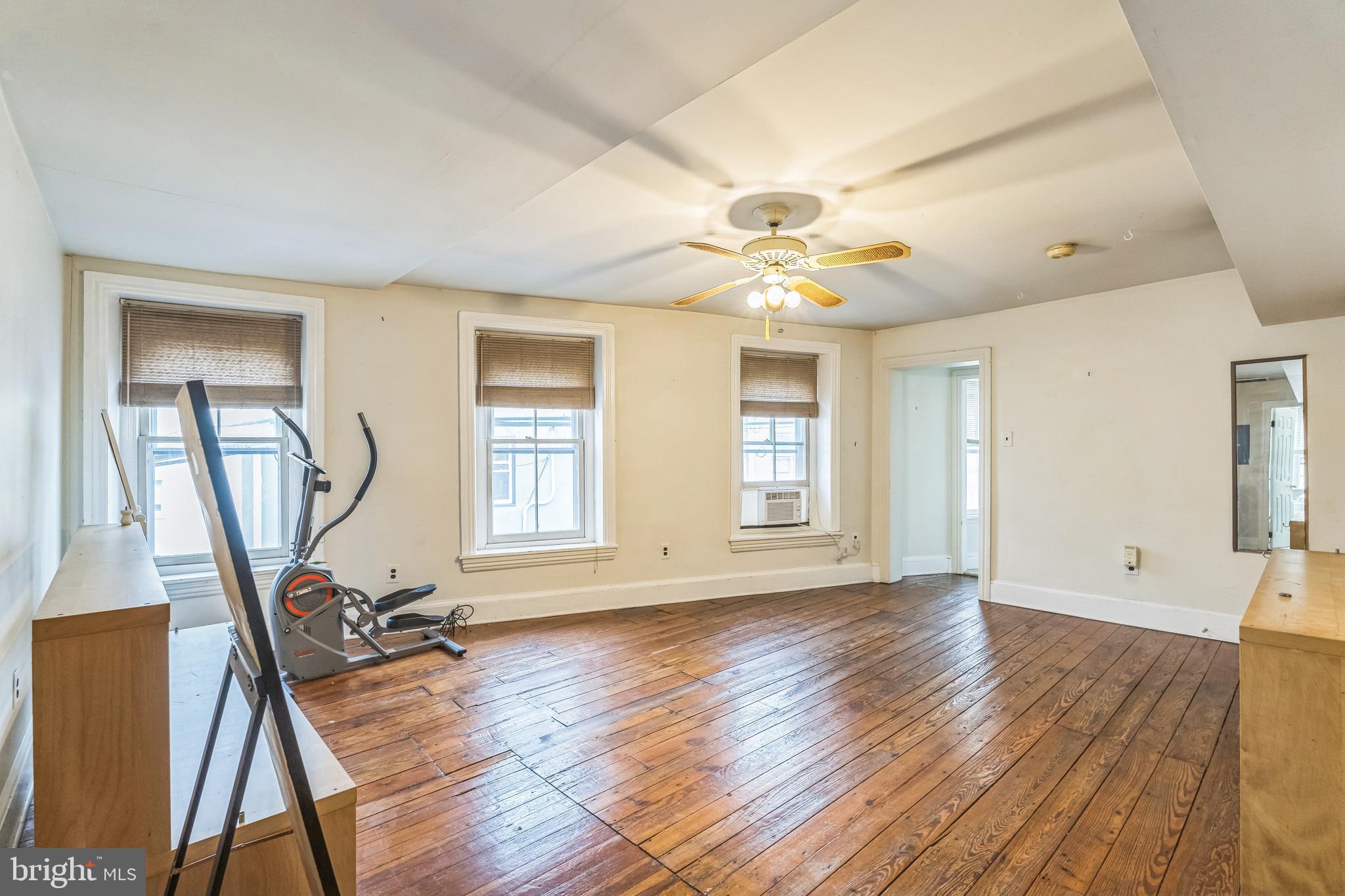 4417 Baker Street Philadelphia, PA 19127 - Photo 19 of 50 a view of a room with wooden floor and ceiling fan