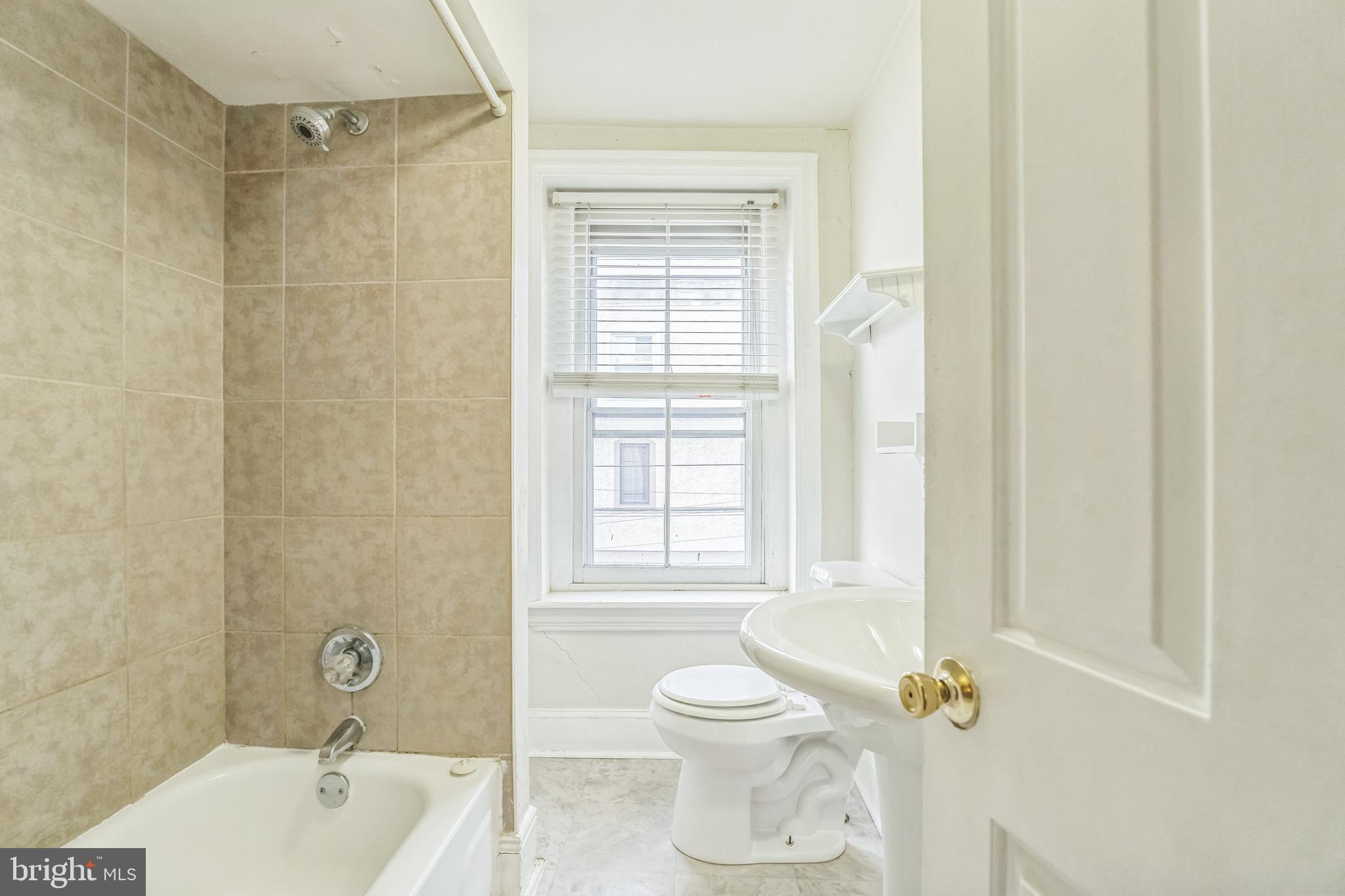 4417 Baker Street Philadelphia, PA 19127 - Photo 21 of 50 a bathroom with a sink toilet and shower