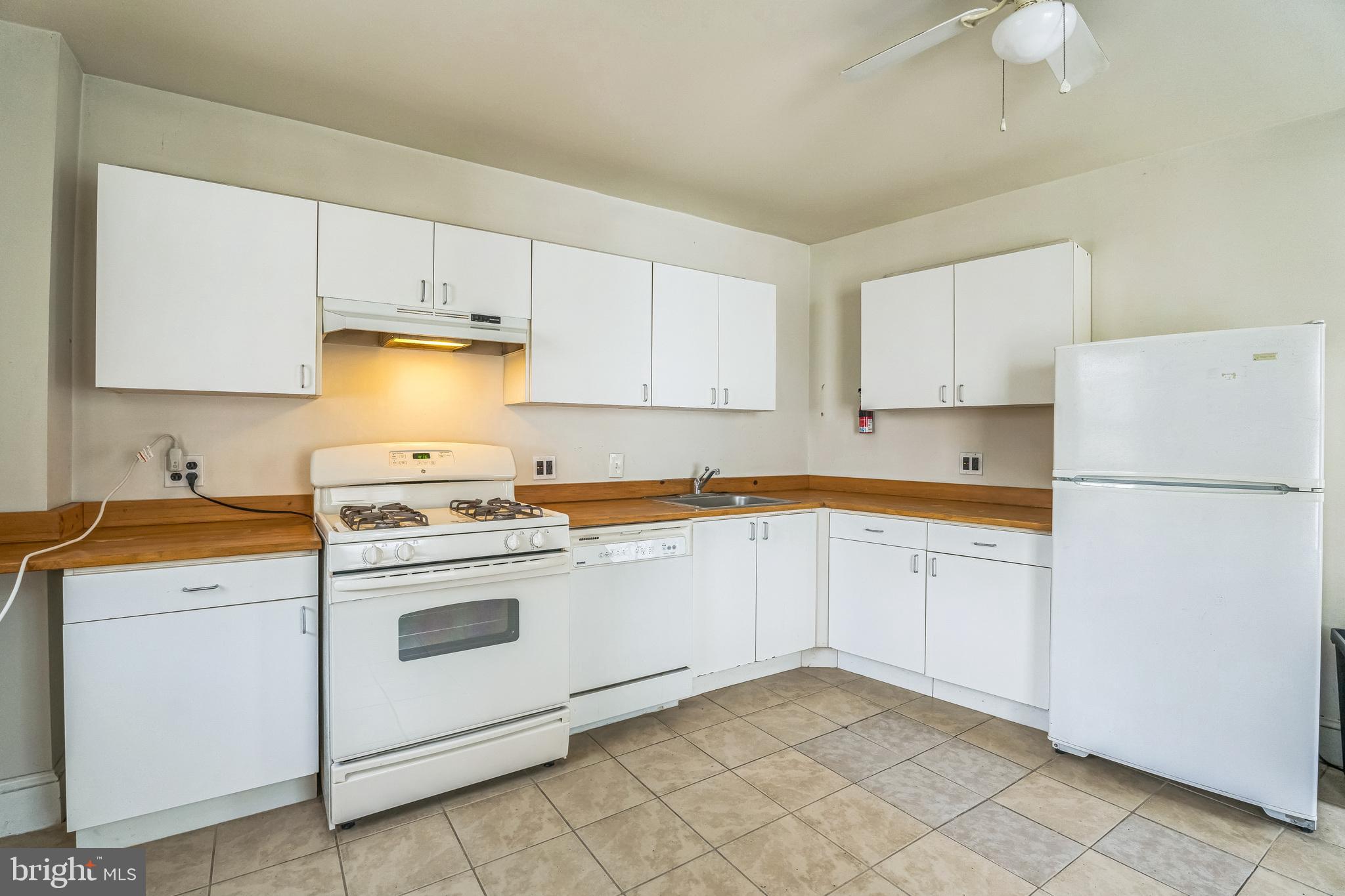 4417 Baker Street Philadelphia, PA 19127 - Photo 25 of 50 a kitchen with cabinets appliances and a sink