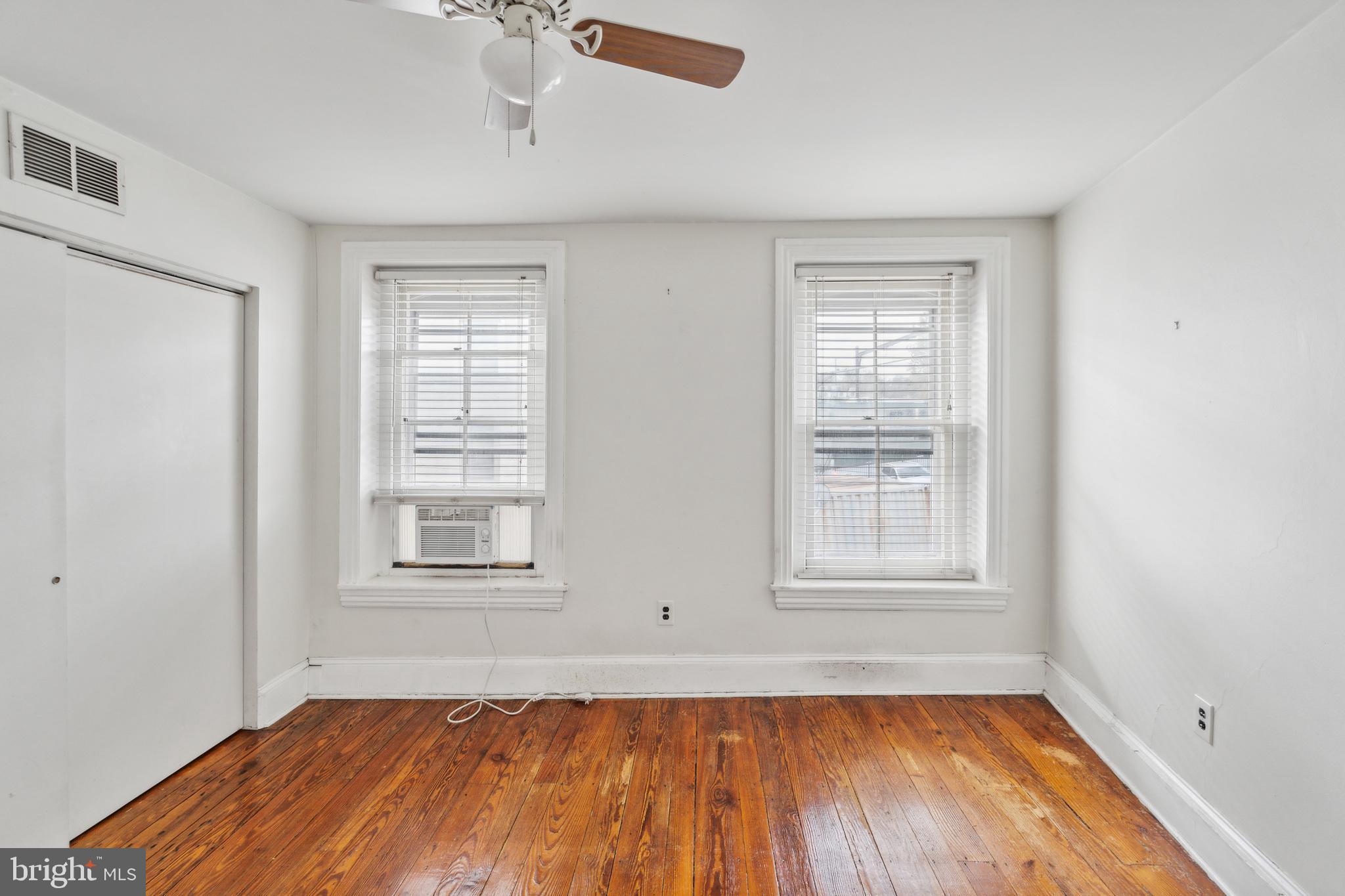 4417 Baker Street Philadelphia, PA 19127 - Photo 28 of 50 a view of an empty room with wooden floor and a window