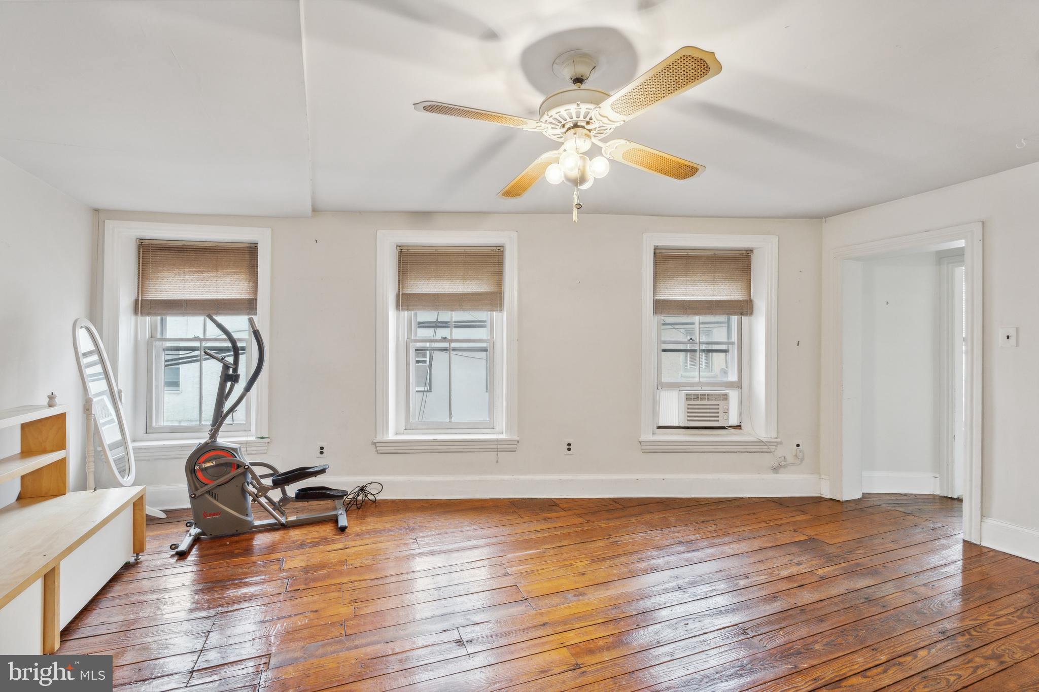 4417 Baker Street Philadelphia, PA 19127 - Photo 30 of 50 a view of a room with wooden floor and gym equipment