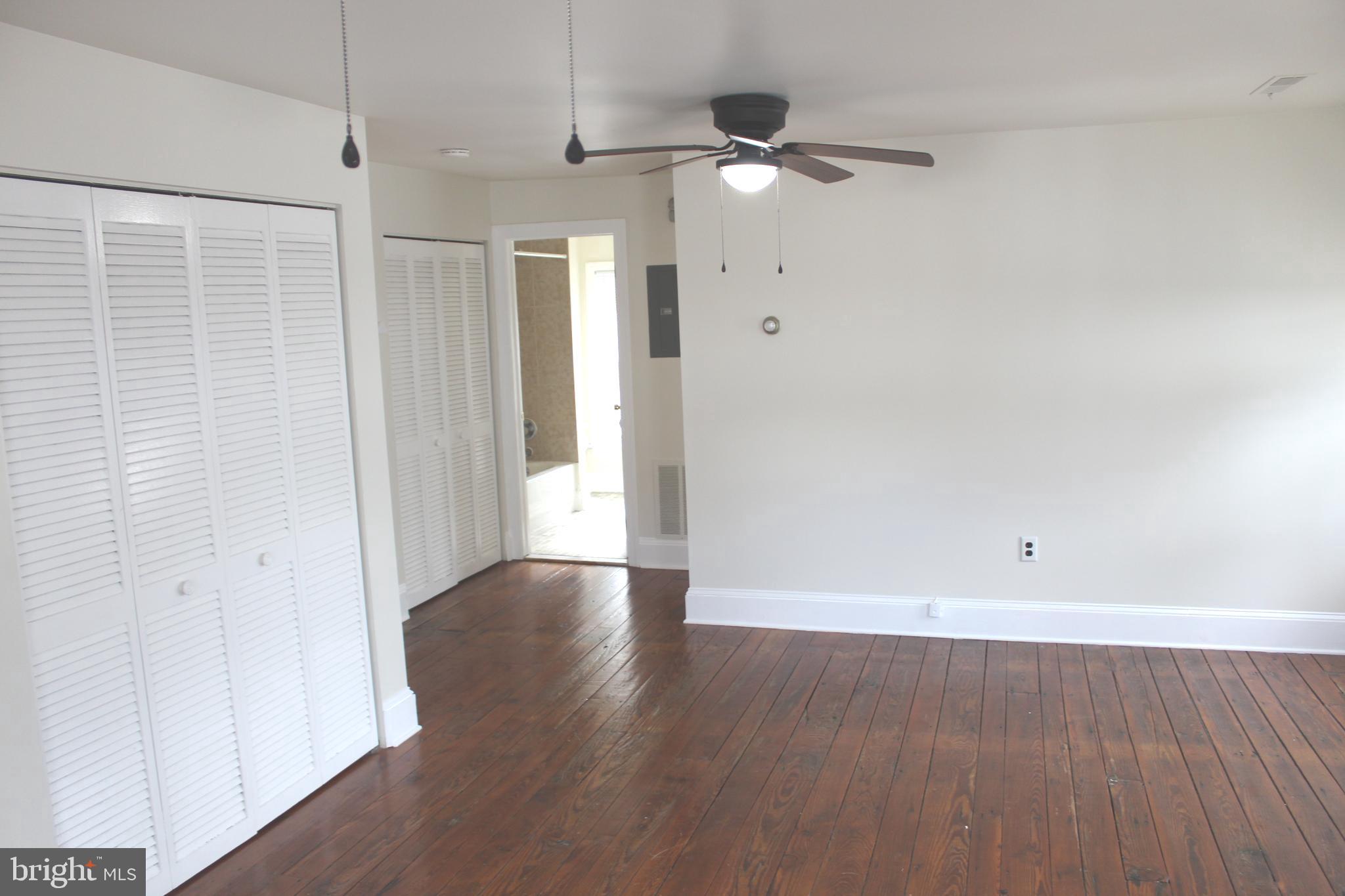 4417 Baker Street Philadelphia, PA 19127 - Photo 35 of 50 a view of an empty room with wooden floor