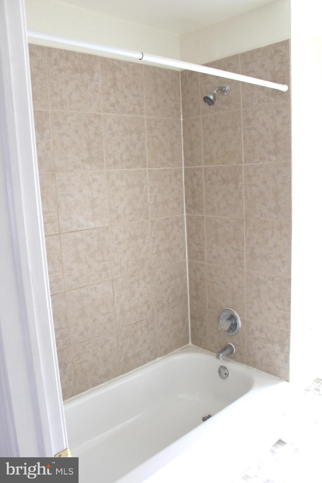 4417 Baker Street Philadelphia, PA 19127 - Photo 38 of 50 a bathroom with a bathtub and shower