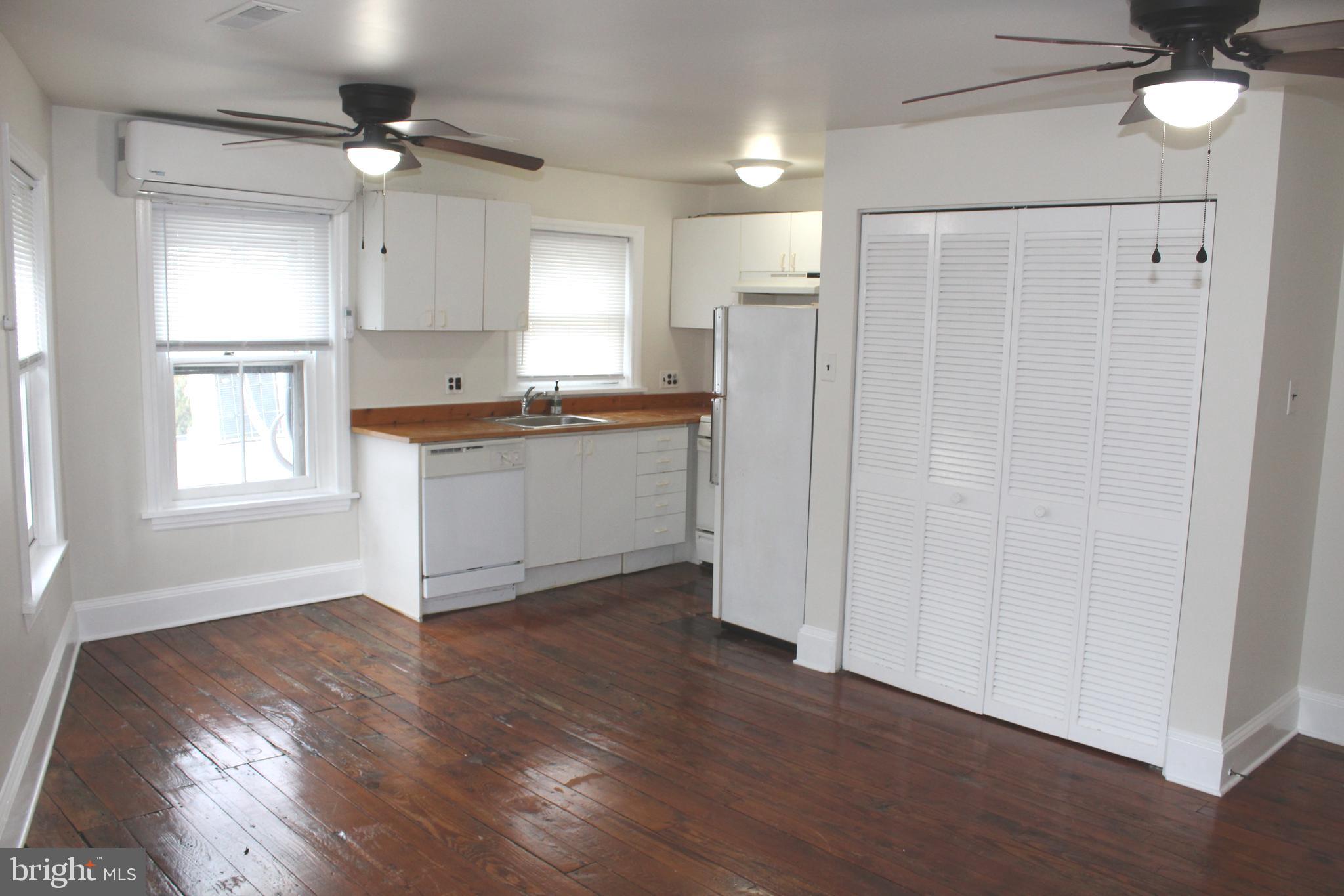 4417 Baker Street Philadelphia, PA 19127 - Photo 42 of 50 a view of a kitchen with a sink a refrigerator and wooden floor