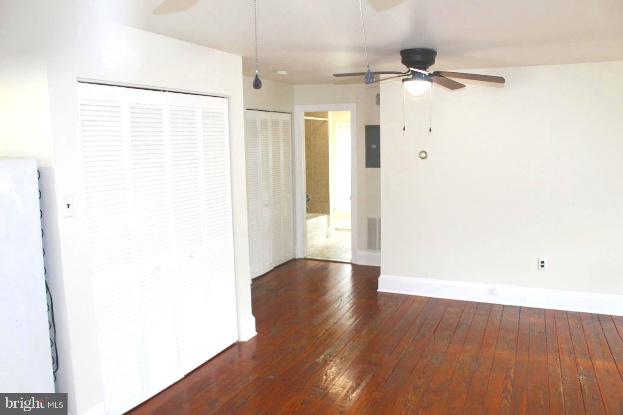 4417 Baker Street Philadelphia, PA 19127 - Photo 45 of 50 a view of an empty room with wooden floor