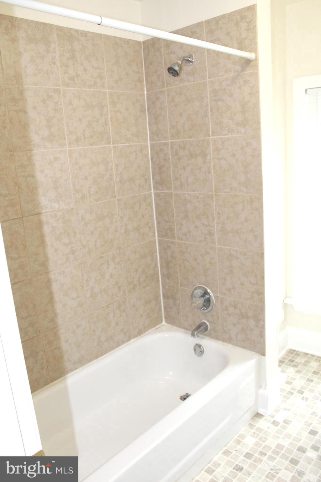 4417 Baker Street Philadelphia, PA 19127 - Photo 50 of 50 a bathroom with a bathtub and shower