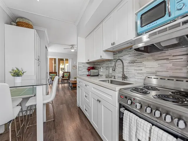 a bathroom with a toilet sink and shower