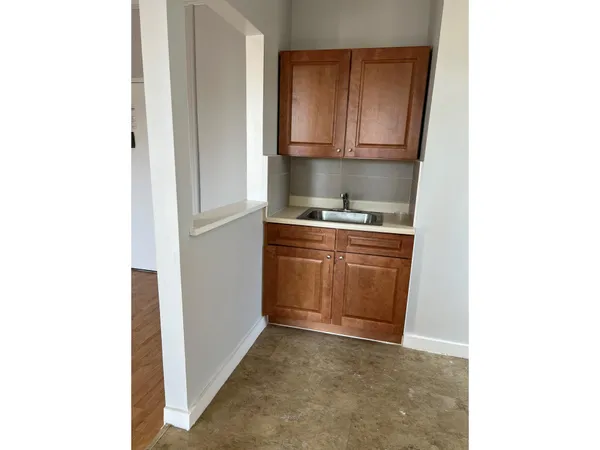 a kitchen with a stove and a microwave