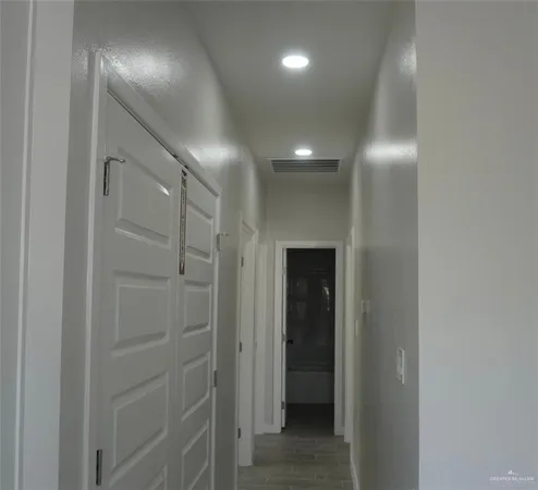 a bathroom with a shower and a glass door