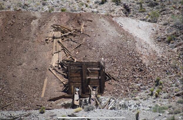 9 Clark Mountain Road Baker, CA 92309 - Photo 29 of 48 a view of a backyard with chairs and a tree