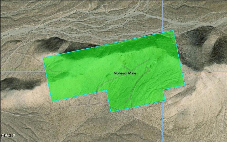 9 Clark Mountain Road Baker, CA 92309 - Photo 5 of 48 a green field with an outdoor space