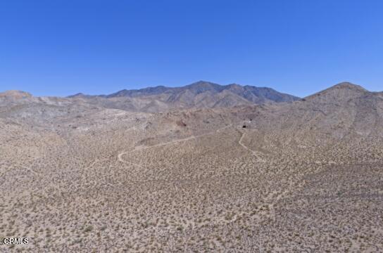 9 Clark Mountain Road Baker, CA 92309 - Photo 6 of 48 a view of a large mountain with mountains in the background