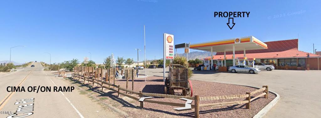 65845 Cima Road Baker, CA 92309 - Photo 9 of 57 a view of a swimming pool with a bench and lawn chairs