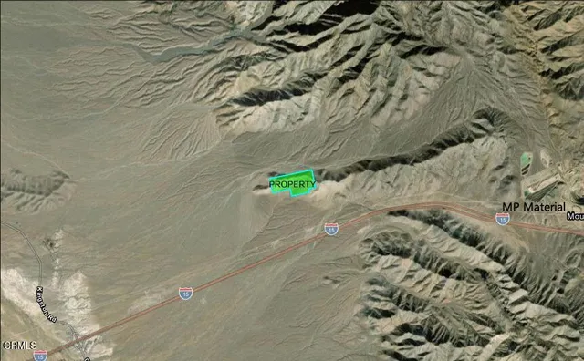 a view of a snow in the background of a mountain