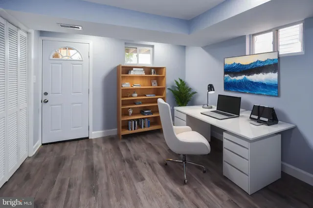 a workspace with furniture and window