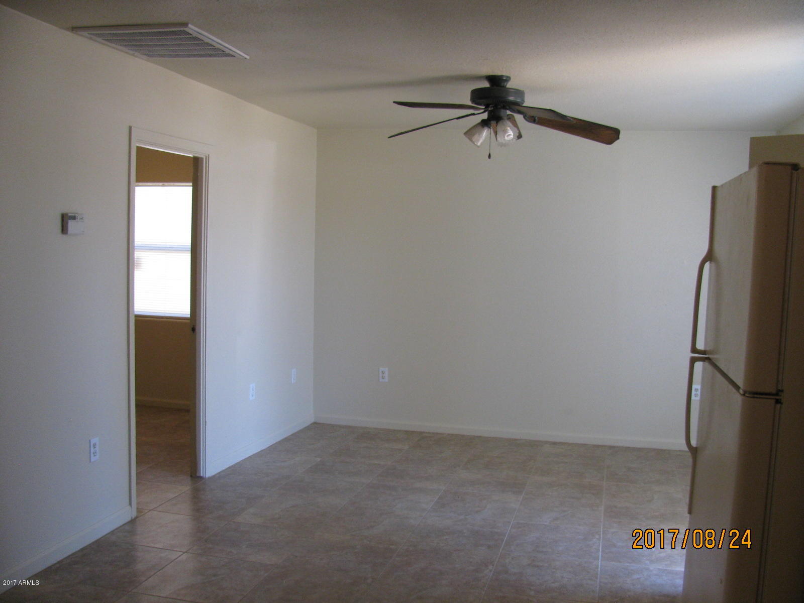 3041 West Granada Road Phoenix, AZ 85009 - Photo 10 of 26 LIVING RM OFF KITCHEN