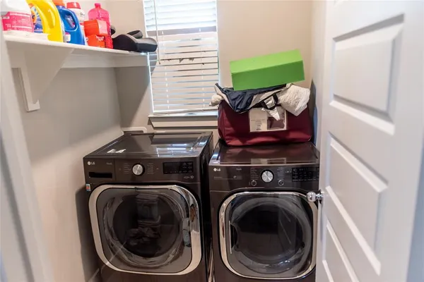 a utility room with dryer and washer