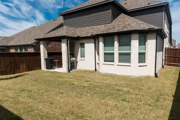 a house with yard in front of it
