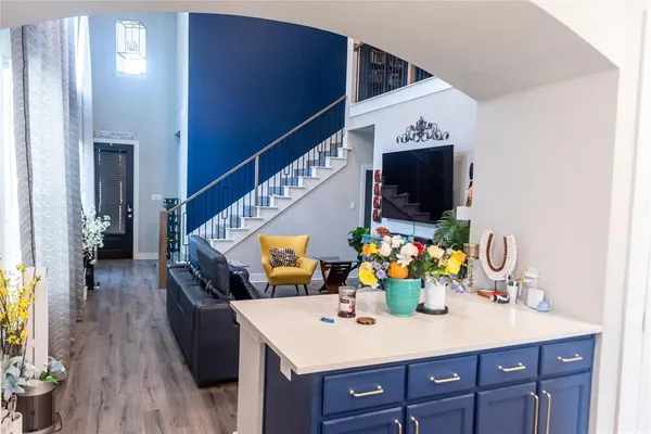 a view of living room with furniture and flat screen tv