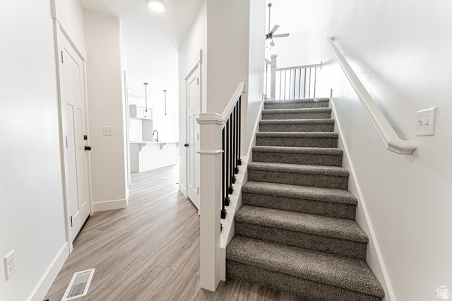4774 Alder Drive Mapleton, UT 84664 - Photo 9 of 27 Stairs featuring ceiling fan and wood finished floors