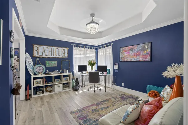 a bedroom with furniture and a chandelier