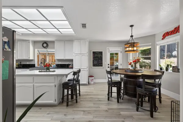 a view of a dining room with furniture window and wooden floor
