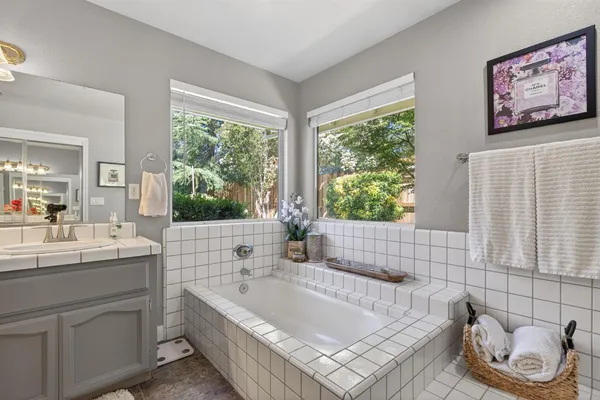 a bathroom with a bathtub and sink