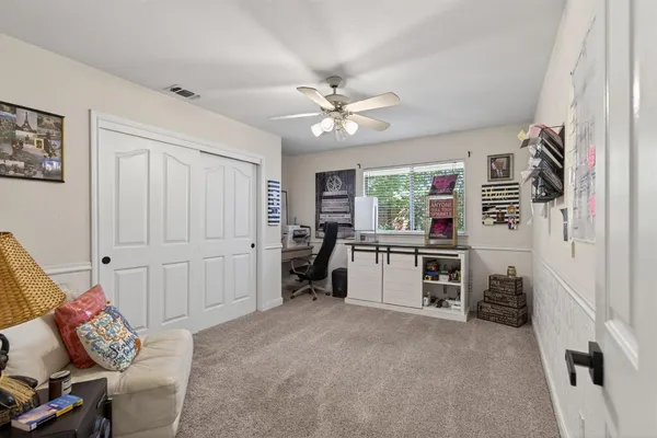 a living room with furniture and a window
