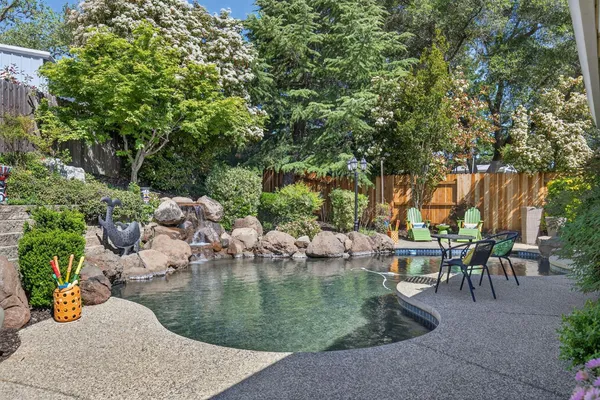 an outdoor space with lounge chair