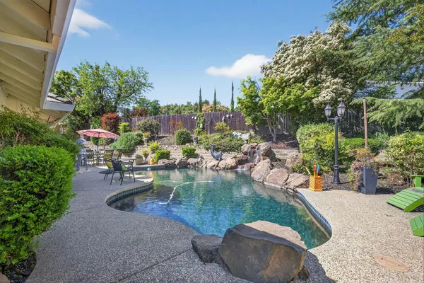 a view of a swimming pool with a patio