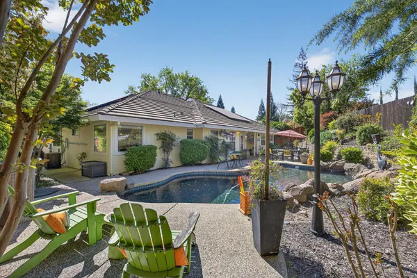 a view of a swimming pool with a patio