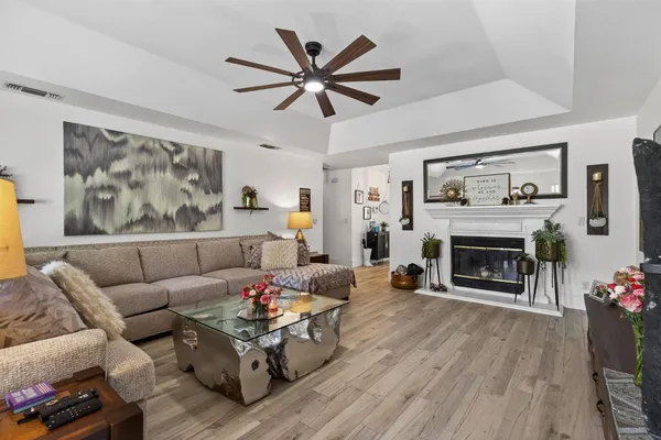 a living room with furniture and a fireplace