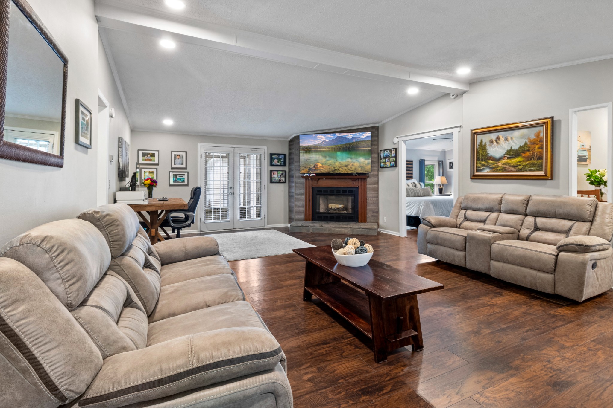 5674 Lakeview Road Springfield, TN 37172 - Photo 19 of 54 a living room with furniture flat screen tv and a fireplace