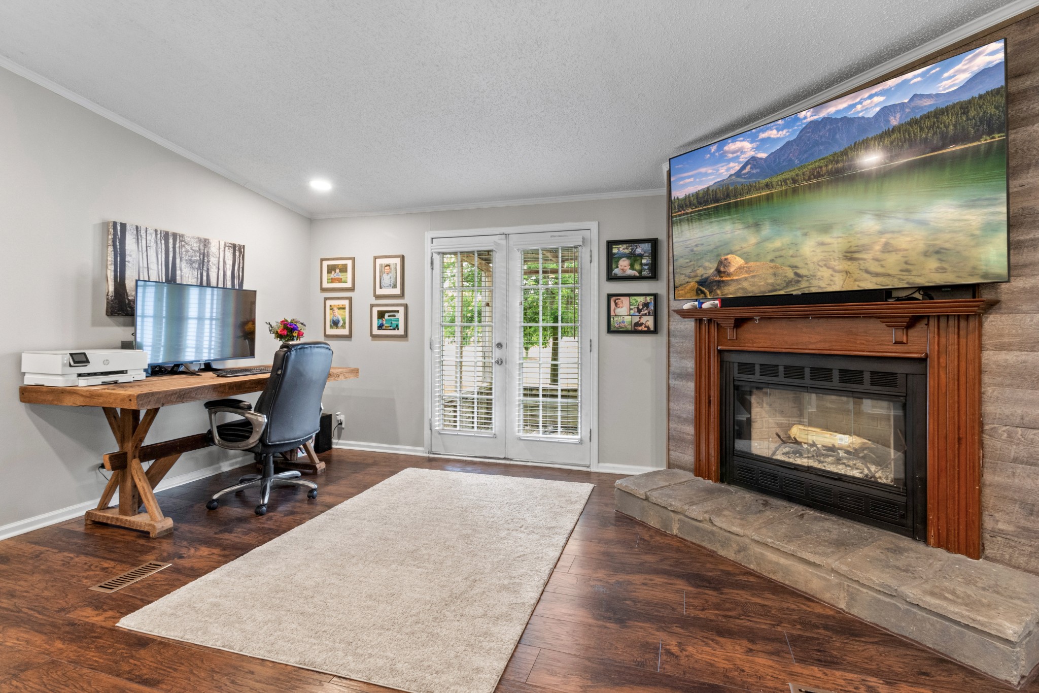 5674 Lakeview Road Springfield, TN 37172 - Photo 25 of 54 a living room with furniture a flat screen tv and a fireplace