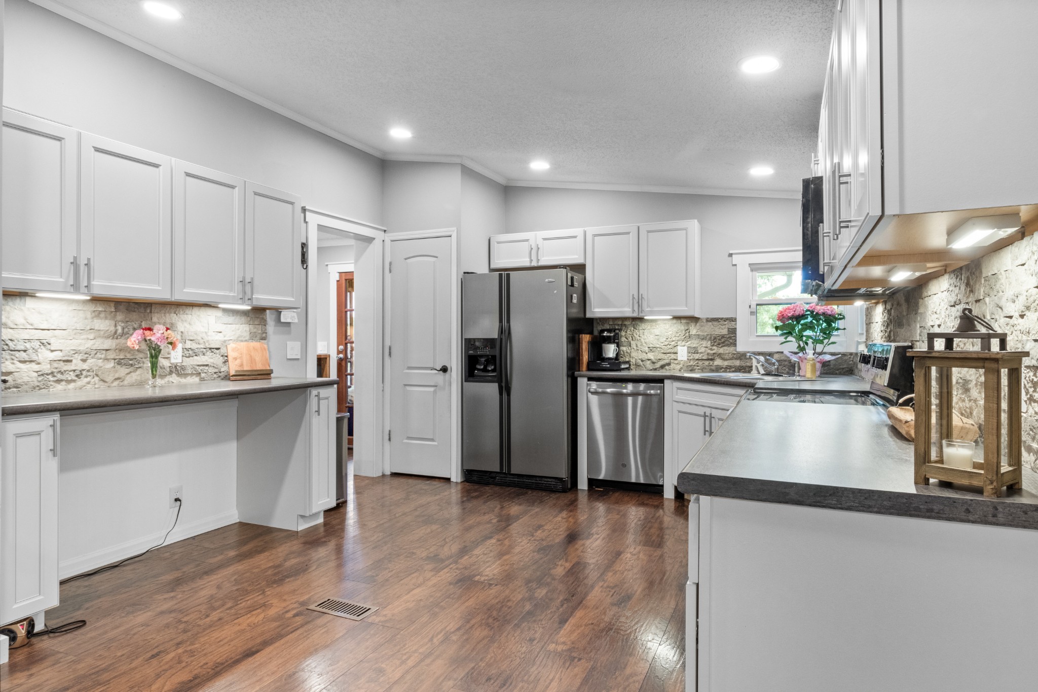 5674 Lakeview Road Springfield, TN 37172 - Photo 35 of 54 a kitchen with granite countertop a refrigerator and a stove top oven